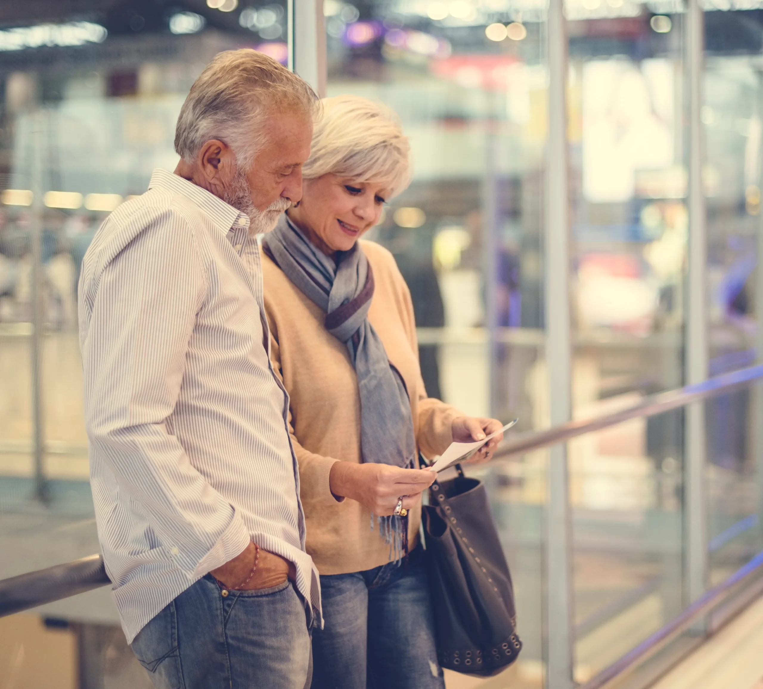 senior couple traveling airport scene