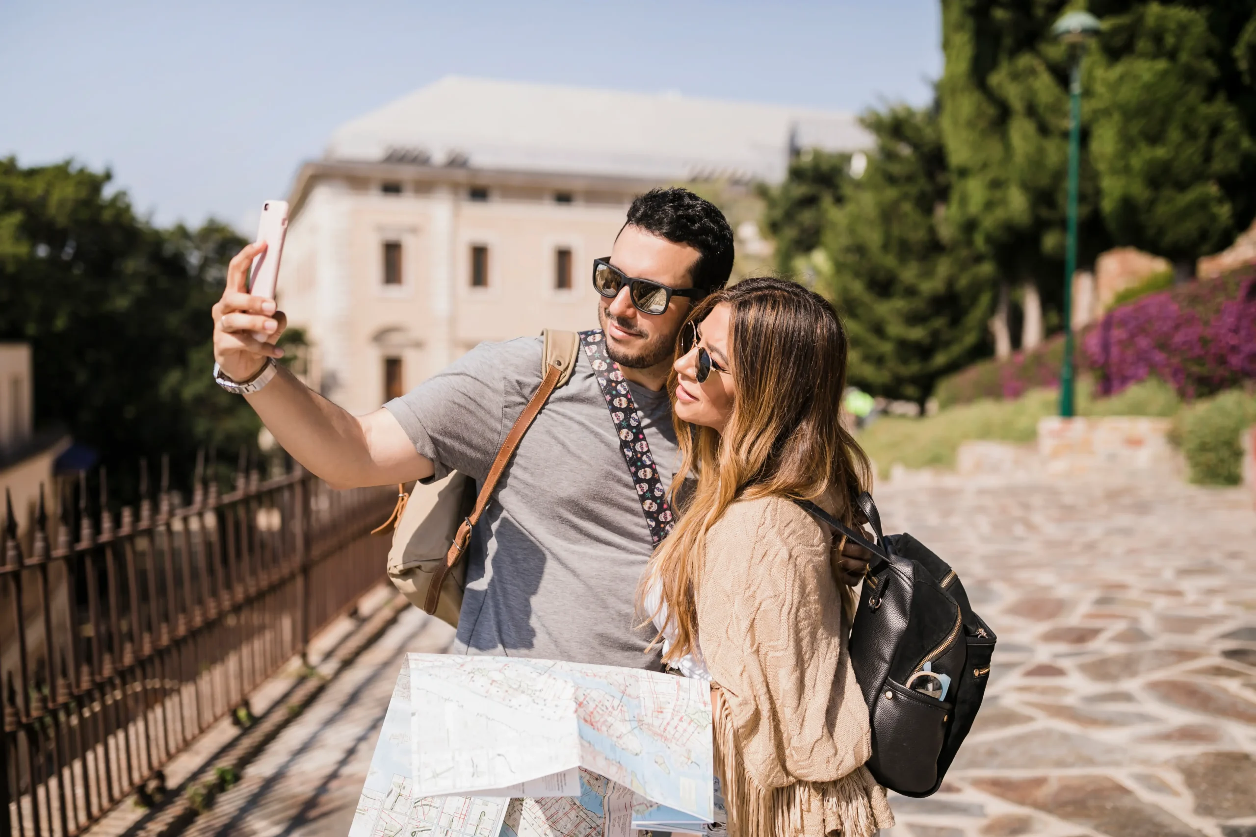 young couple vacation taking self portrait with cell phone