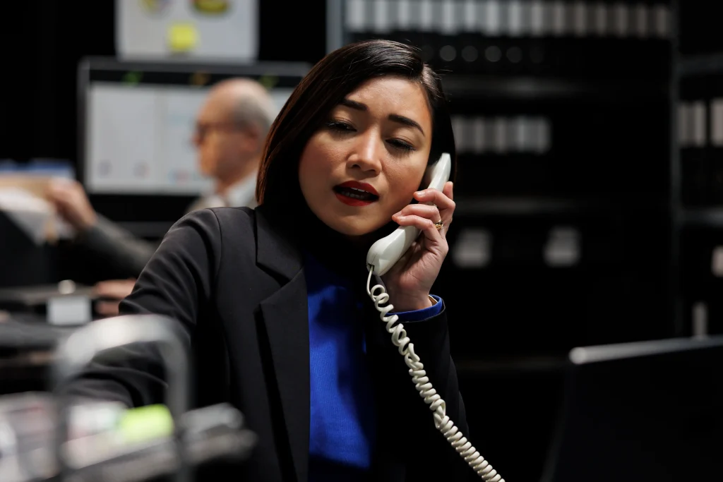 business accountancy consultant making phone call professional administrative workplace employee business company file cabinet depository filled with flowcharts folders