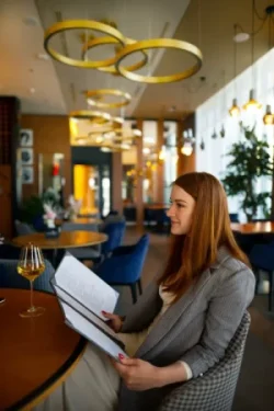 woman looking through menu restaurant