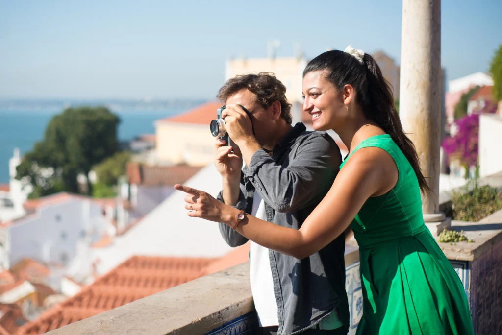 portrait loving couple taking photos summer sea city happy man woman standing city upland enjoying rest man taking photos faraway sea love vacation travelling concept